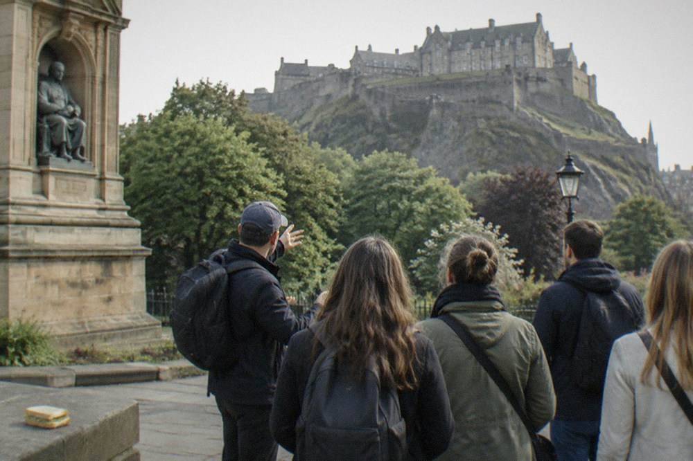Edinburgh Castle rising above the west end of Princes Street Gardens with the Scott Monument in the foreground