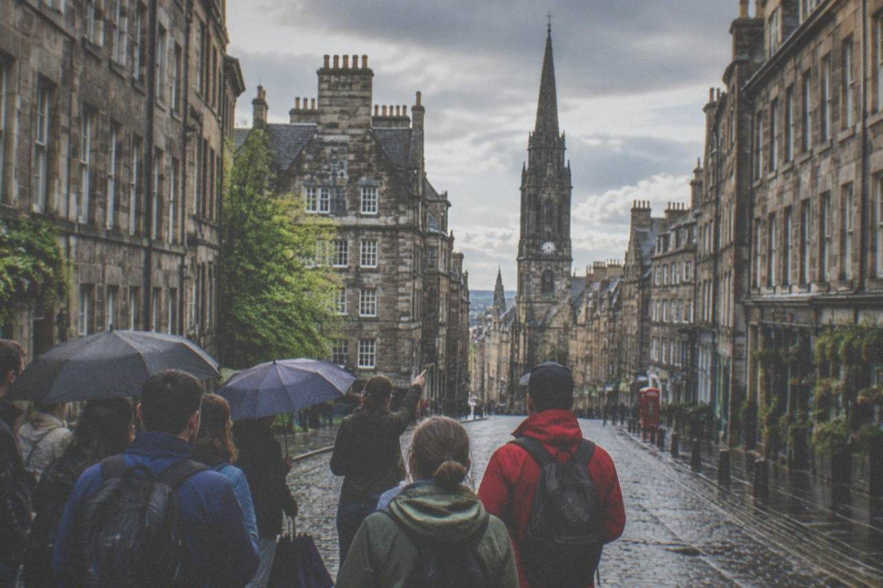 Edinburgh Royal Mile street scene with historic stone buildings rising on both sides