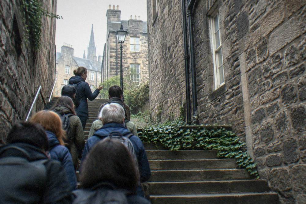A stone close in Edinburgh with worn steps leading between old buildings