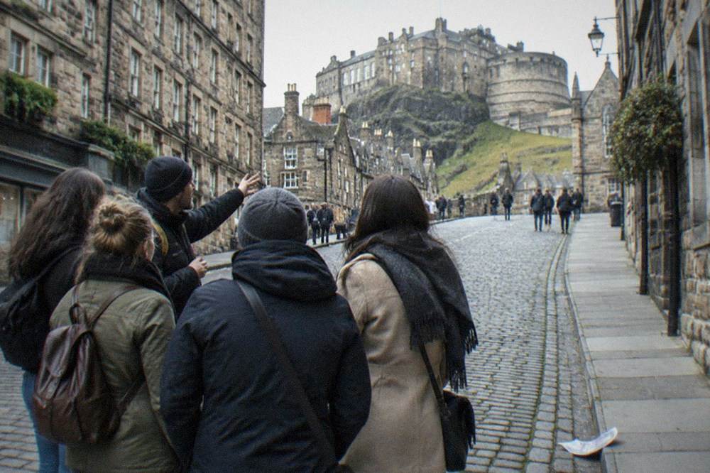 The castle esplanade and gatehouse seen from the Royal Mile with the city skyline behind
