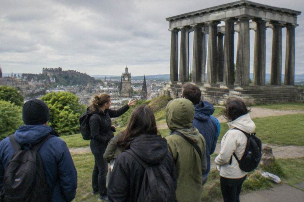 The Athenian columns of the unfinished National Monument on Calton Hill above the city skyline