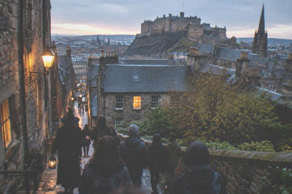 Edinburgh's Old Town rooftops and lanes under an evening sky